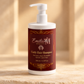 Emilia M Beauty Curly Hair Shampoo bottle against a warm beige arch background