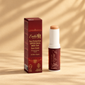 Emilia M Beauty SPF50 Tinted Mineral Sunscreen Stick on a warm sandy background