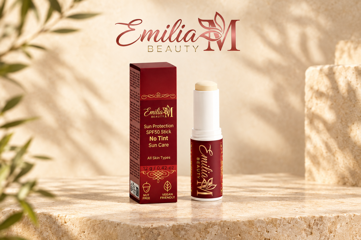 Emilia M Beauty Sun Protection SPF50 Stick No Tint displayed with its burgundy box in a warm beige setting