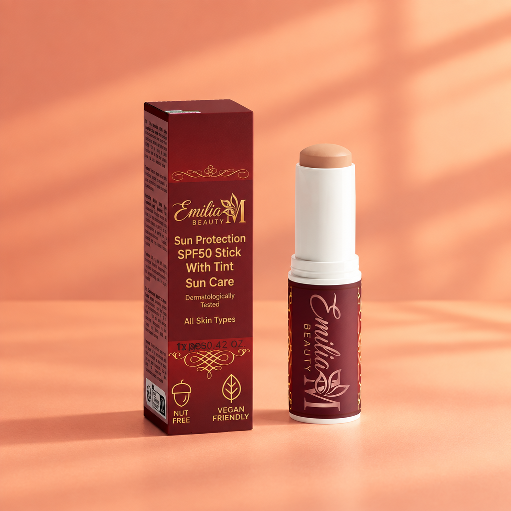 Emilia M Beauty SPF50 Tinted Mineral Sunscreen Stick against a soft peach coral background